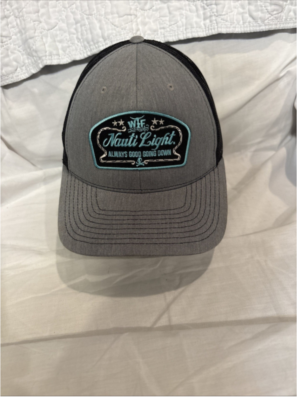 What The Fin “Nauti Lite” Trucker Hat